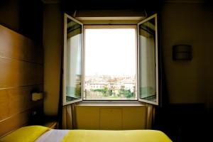Postel nebo postele na pokoji v ubytování Ibis Styles Parma Toscanini