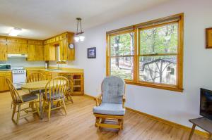 a kitchen and dining room with a table and chairs at Shenandoah National Park Cabin with Patio! in McGaheysville