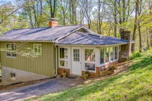 a green tiny house in the woods at Shenandoah National Park Cabin with Patio! in McGaheysville