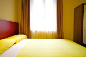 Postel nebo postele na pokoji v ubytování Ibis Styles Parma Toscanini