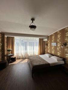 Ένα ή περισσότερα κρεβάτια σε δωμάτιο στο Hotel Plazma