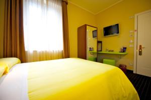Postel nebo postele na pokoji v ubytování Ibis Styles Parma Toscanini