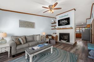 a living room with a couch and a fireplace at SDG2 Sea Glass Shack in Kitty Hawk