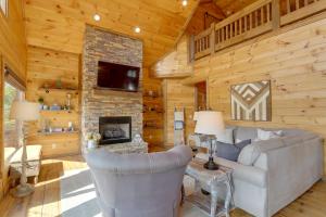 a living room with a couch and a fireplace at Family Oasis with Game Room and 2 Decks in Blue Ridge! in Ballew Mill