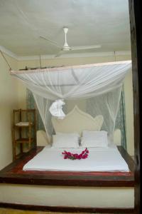 Ένα ή περισσότερα κρεβάτια σε δωμάτιο στο Rafiki budget master room in paje