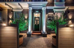 a front door of a building with a green door at The Bromley's in Great Yarmouth