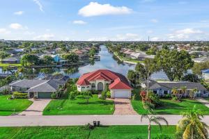 an aerial view of a river with houses at Casa Amarilla Cape Coral Luxury Waterfront Escape in Cape Coral Hospital Heliport