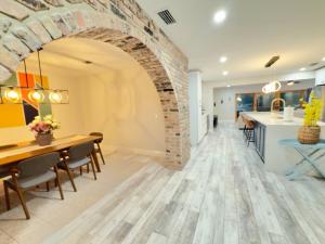 a kitchen and dining room with a brick wall at Serenety Shores in West Palm Beach