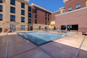 a swimming pool in front of a building at Homewood Suites By Hilton Oklahoma City Quail Springs in Oklahoma City