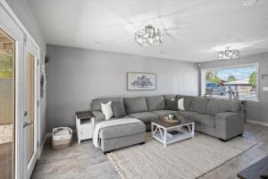 a living room with a couch and a table at Tucson Oasis by Rather Be Properties in Tucson