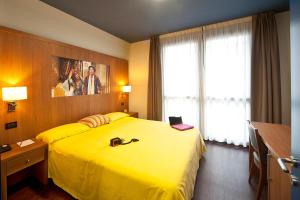 Postel nebo postele na pokoji v ubytování Ibis Styles Parma Toscanini