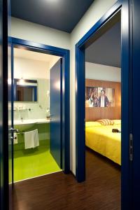 Postel nebo postele na pokoji v ubytování Ibis Styles Parma Toscanini