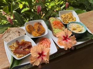 a tray with different types of food on a table at Plaza Tucanito - jungle up your life in Cahuita