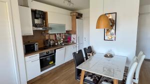 a kitchen and dining room with a table and chairs at Your temporary home in Vienna in Vienna