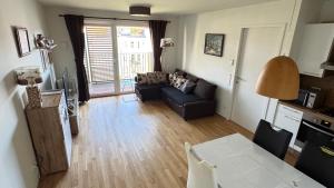 a living room with a couch and a table at Your temporary home in Vienna in Vienna +6 photos