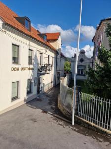 a white building with a fence in front of it at Antica Dolina in Postojna