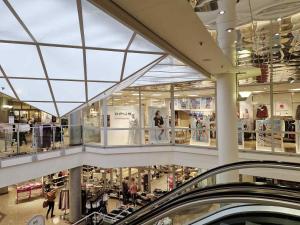 a view of a shopping mall with a glass ceiling at Zentrum der Ruhe - Appartment in Waldmohr
