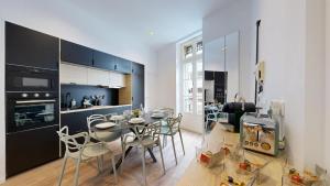 a kitchen and dining room with a table and chairs at expat renting - La Rotonde - Prestige - Netflix in Toulouse