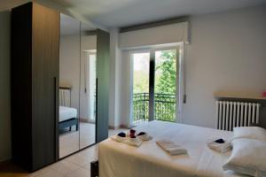 Postel nebo postele na pokoji v ubytování Adua Residence