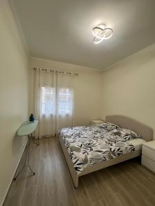 a bedroom with a bed and a window at Superbe appart près de la mer in Nice