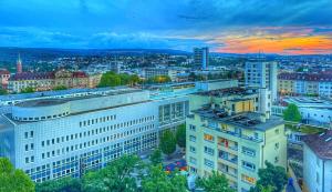 an aerial view of a city at sunset at Penthouse Apartment Zentral mit Goldstadtblick in Pforzheim
