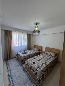 Ένα ή περισσότερα κρεβάτια σε δωμάτιο στο Alkeo's Apartments