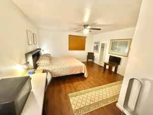 a bedroom with a bed and a ceiling fan at Redwood View Suite 326SQFT Private Entrance and Bath in Scotts Valley