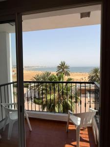 a room with a balcony with a view of the beach at marina1 in Agadir