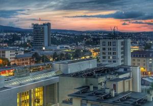 a view of a city at night with buildings at Deluxe Penthouse Suite zentral mit Goldstadtblick in Pforzheim