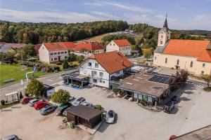 an aerial view of a small town with a church at Guesthouse Siva Čaplja in Ptuj