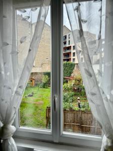 Zahrada ubytování T1 calme et confort Avenue Garibaldi - DABNB + 12 fotografií