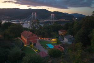 a view of a bridge over a river with a house at Lar de Sefa 15 in Redondela