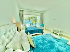 Ένα ή περισσότερα κρεβάτια σε δωμάτιο στο Sea Winds Cabarete +26 φωτογραφίες