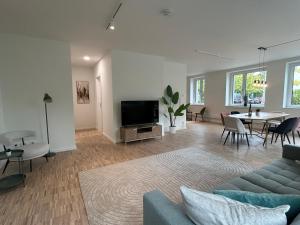 Televisyen dan/atau pusat hiburan di GIH Apartments - Neufahrn