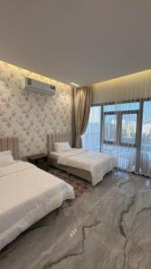 Postel nebo postele na pokoji v ubytování Dream Villa chalet Guest House