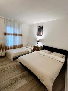Katil atau katil-katil dalam bilik di Superbe 57 appartement 2