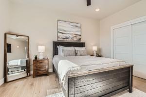 a bedroom with a large bed and a mirror at Helling 203 in Heber City +87 photos