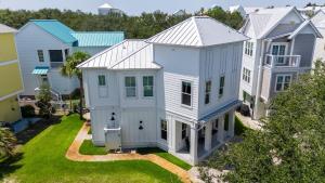 an aerial view of a row of houses at 4BR Coastal Retreat w Pool Patio Games Lagniappe at Blue Mountain in Blue Gulf Beach