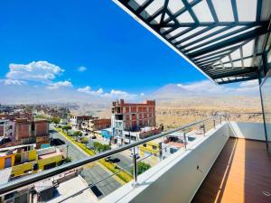 a view of a city from the balcony of a building at HOTEL ALTIVA - Arequipa in Cayma