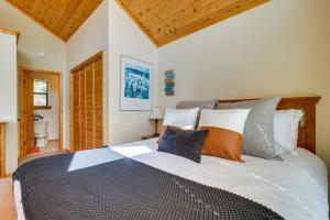 a bedroom with a large bed with pillows at Mtn-View Deck: Cabin Getaway in Angel Fire in Angel Fire