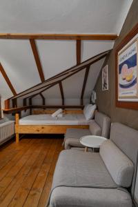 a living room with two couches and a table at Interbelic Villa near Old Town in Bucharest +61 photos