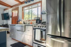 a kitchen with stainless steel appliances and a window at The Love Shack in Carmel +11 photos