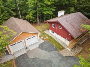 an overhead view of a red barn with two garage doors at Mittenwald Lodge in Goodrich Falls