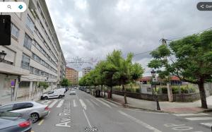 a city street with cars parked on the street at Apartamento Ponte Stay 33 in Ponteareas