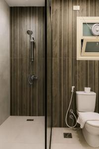 a bathroom with a shower and a toilet at Diva Suites in Hurghada