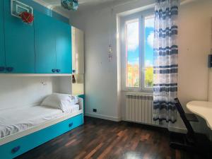 a small room with a bed and a window at Domus Oleandri - WelcomeToRhome in Rome