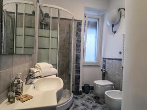 a bathroom with a sink and a toilet at Domus Oleandri - WelcomeToRhome in Rome
