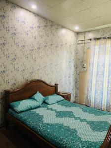 Postel nebo postele na pokoji v ubytování Zohaib Guest House