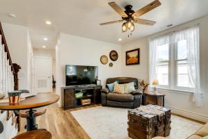 a living room with a couch and a tv at ATV and UTV Parking Spacious Home in Richfield! in Richfield