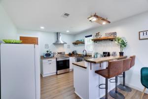 a kitchen with white appliances and wooden floors at Cozy 2 Bedroom apartment in Tannersville, minutes from Camelback Mountain in Tannersville